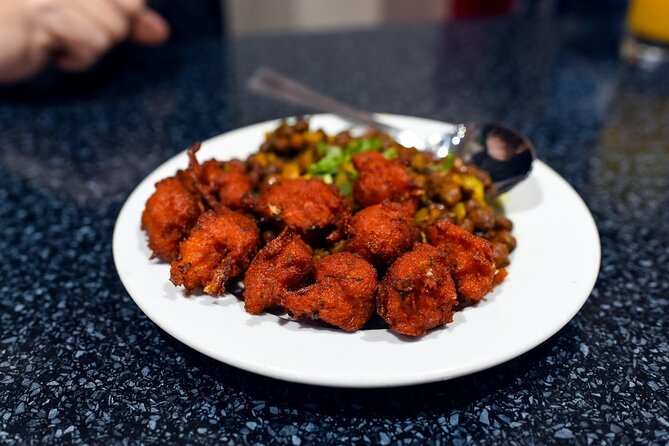 East London Indian Food Tour with 8+ Authentic Food Tastings - Three restaurants, a sweet shop, and a market stop
