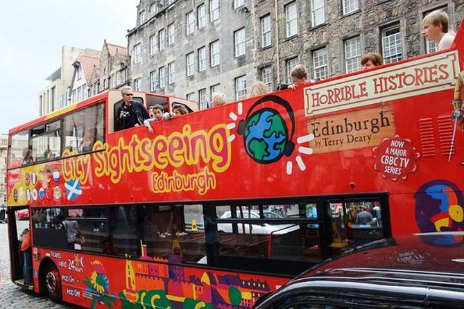 Edinburgh Rail Trip from London with Castle entry and Hop-on Hop-off bus - Holyroodhouse and the National Museum are choices, not promises