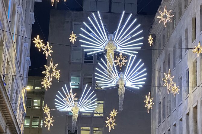 London Christmas Lights Guided Tour With Christmas Music - Seven Dials turns the route into a ceiling of light